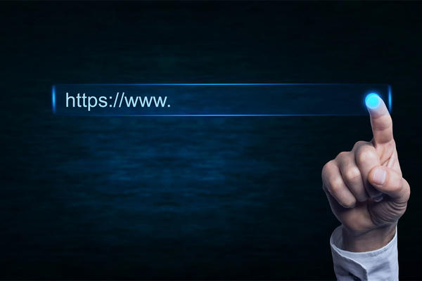Person touching a URL on a screen