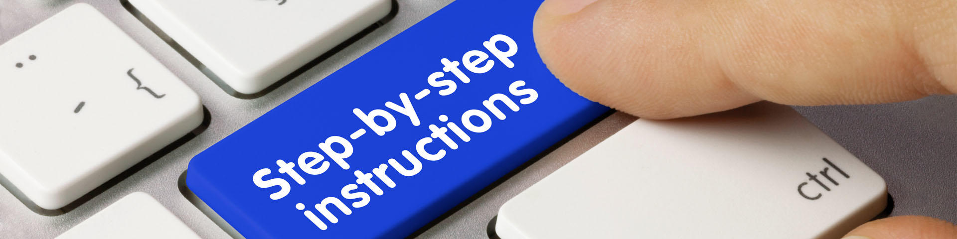 Keyboard button labeled step-by-step instructions